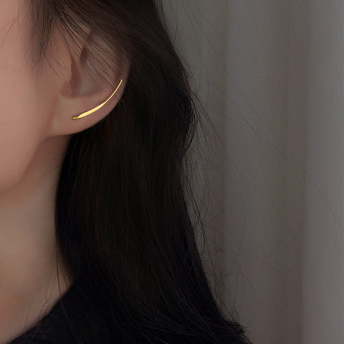 Gold Minimal Curved Threader Earrings Polished Metal Jewelry shown on a neutral display