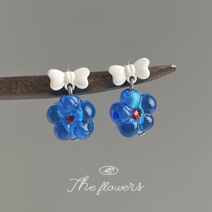 White Bow Blue Glass Flower Drop Earrings Red Centers