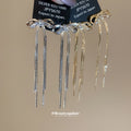 Crystal Bow Chain Tassel Earrings in Gold and Silver Tones view 3