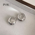 Polished Oval Huggie Hoop Earrings In Gold Silver And Three Sizes view 9