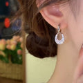 Silver Tone Crystal Teardrop Huggie Earrings With Open Centers view 3