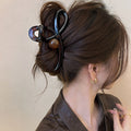 Gunmetal Tone Sculptural Loop Hair Claw With Large Round Bead Detail view 6