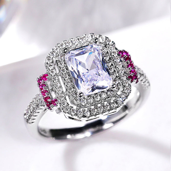 Square White Stone Ring with Pink Side Stones and Pavé Halo