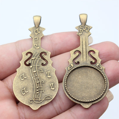 Two Finish Violin Round Pendant Setting shown in hand
