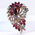 Oval Gem Feather Brooch In Eight Colorways With Polished Metal Detail view 2