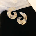 Textured Open Circle Stud Earrings In Gold And Silver view 2