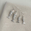 Silver Tone Textured Fish Dangle Earrings Orange Crystal Eyes view 4