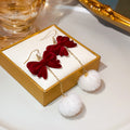 Burgundy Velvet Bow Gold Chain White Pom Pom Hook Earrings view 4
