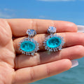 Aqua Blue Oval Halo Stone Drop Earrings in Silver Tone view 4