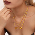 Split Heart Pendant Snake Chain Necklace Gold and Steel view 4