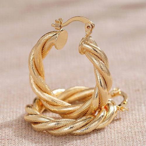 Gold Tone Triple Twist Hoop Earrings Polished Statement Fashion Jewelry displayed from another angle