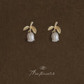 Gold Leaf Stem Stud Earrings With White Pearl Flower Buds view 3