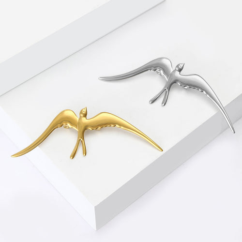 The second image presents an alternate display of the swallow brooch.