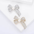 Crystal Ribbon Bow Brooch With Pearl in Gold or Silver Tone view 1
