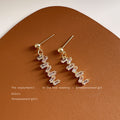 Gold Zigzag Baguette Drop Earrings Clear Stone Dangles view 3