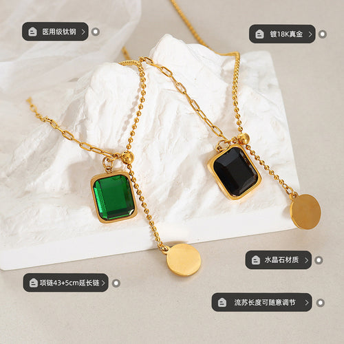 Green and black crystal square pendants flatlay with material labels
