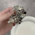 Sculpted Metal Flower Cluster Earrings in Gold and Silver view 7