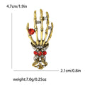 Skeleton Hand Brooch With Jeweled Ring and Ornate Cuff view 7