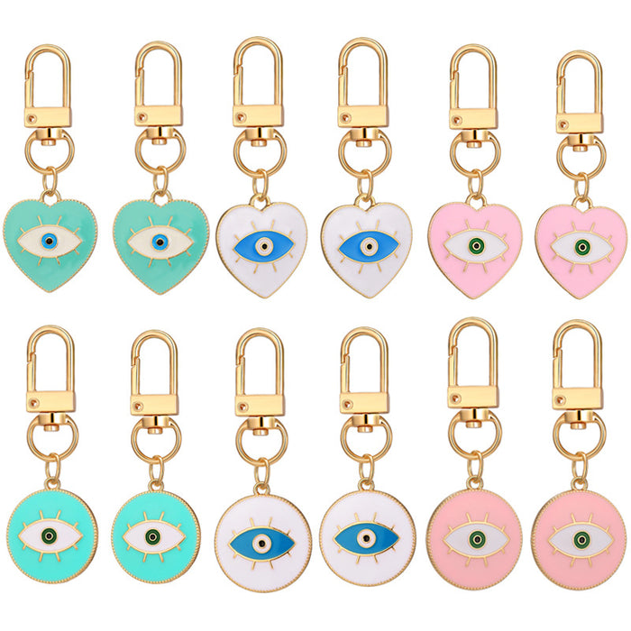 Twelve Piece Gold Tone Pastel Heart and Round Evil Eye Keychain Set