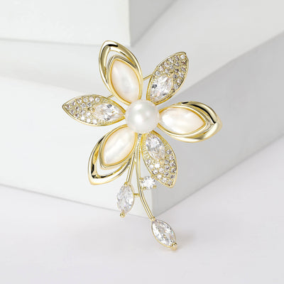 Gold camellia brooch with white shell petals and pearl center