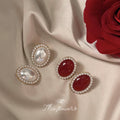Oval Pearl Center Stud Earrings Mini Pearl Halo Gold Frame view 1