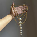 Layered Gold Tone Chain Necklace With Long Graduated Pearl Drop view 2