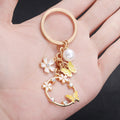 Yellow Openwork Butterfly Flower and Faux Pearl Charm Keychain view 4