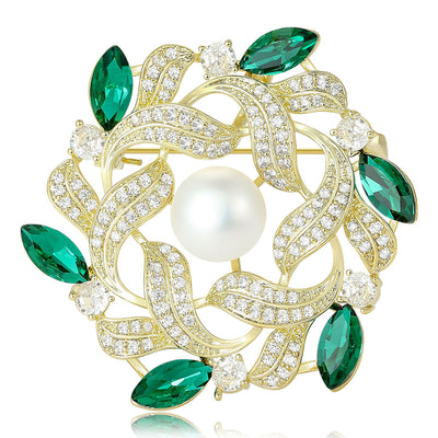 Front view of the pearl leaf wreath brooch in purple or green with polished metal detail on a white background
