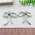 Silver-Tone Bow and Butterfly Metal Charms with 18 Listed Options view 11