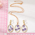 Gold Tone Oval Purple Petal Resin Pendant Necklace and Drop Earrings view 4