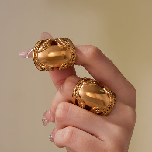 Display view of sculptural wide open ring in gold tone in main image 2.
