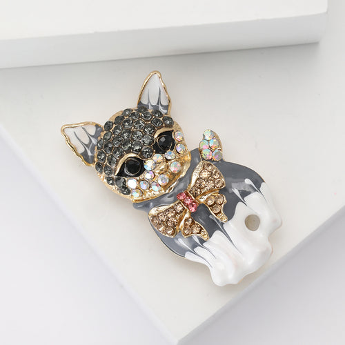 Angled display of the brooch showing its raised decorative details