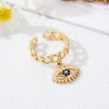Gold Tone Curb Chain Crystal Evil Eye and Hamsa Charm Rings view 4