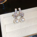 Silver Tone Crystal Knot and Pearl Drop Earrings Decorative Jewelry view 6