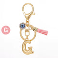 Gold Tone Initial Letter Keychain with Evil Eye and Pink Tassel view 12