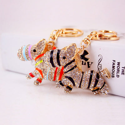 Black-striped and multicolor rhinestone donkey keychains displayed together.