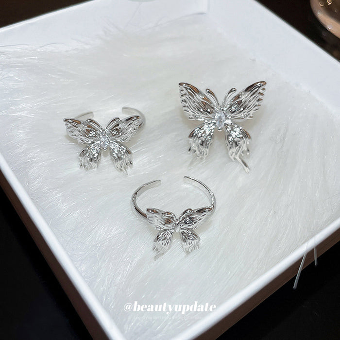 Silver Tone Sculpted Butterfly Open Ring With Clear Crystal Center