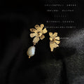 Gold Asymmetric Flower Studs One with Baroque Pearl Drop view 1