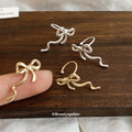 Minimal Ribbon Bow Ear Clips in Gold and Silver Tones view 4