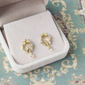 Gold Tone Leaf Wreath Green And Clear Stone Drop Stud Earrings view 1