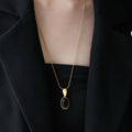 Oval Black Cabochon Pendant Necklace in Gold and Silver Tones view 3