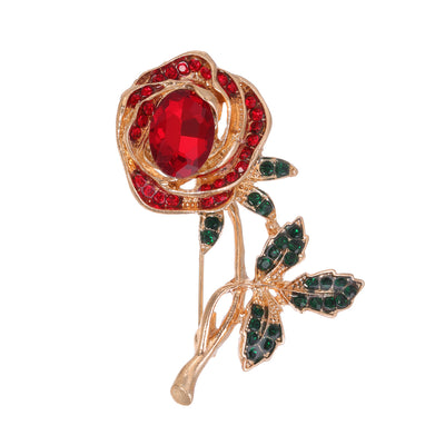 Front product view of an antique ruby and emerald rose brooch