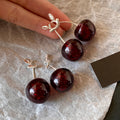 Dark Red Cherry Drop Earrings with Silver Tone Bows view 3