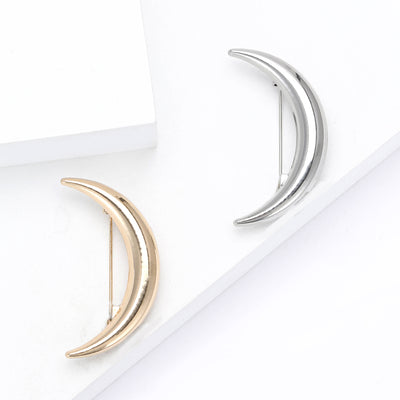 Front view of a smooth double-curve crescent with a polished metallic finish