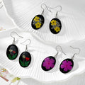Black Oval Pressed Flower Drop Earrings in Nine Botanical Designs view 2