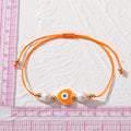 Cord and Pearl Accent Heart Evil Eye Bracelets in Nine Colors view 5