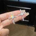 Dainty Crystal Cross Ear Clips in Gold and Silver Tone Finishes view 2
