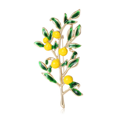 A leafy branch carrying small yellow lemons shown on a white background