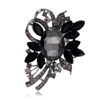 Front product view of the black and white crystal flower brooch