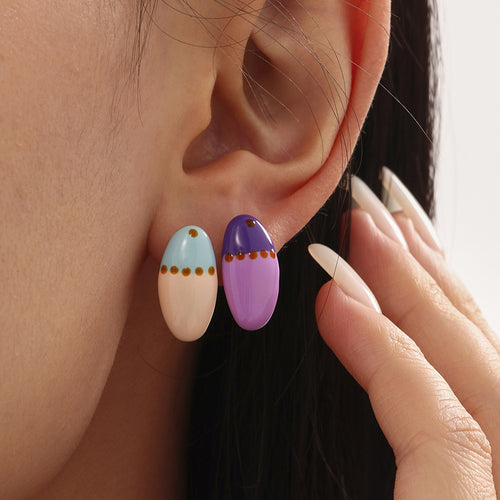Ear with purple and pink-blue oval colorblock stud earrings